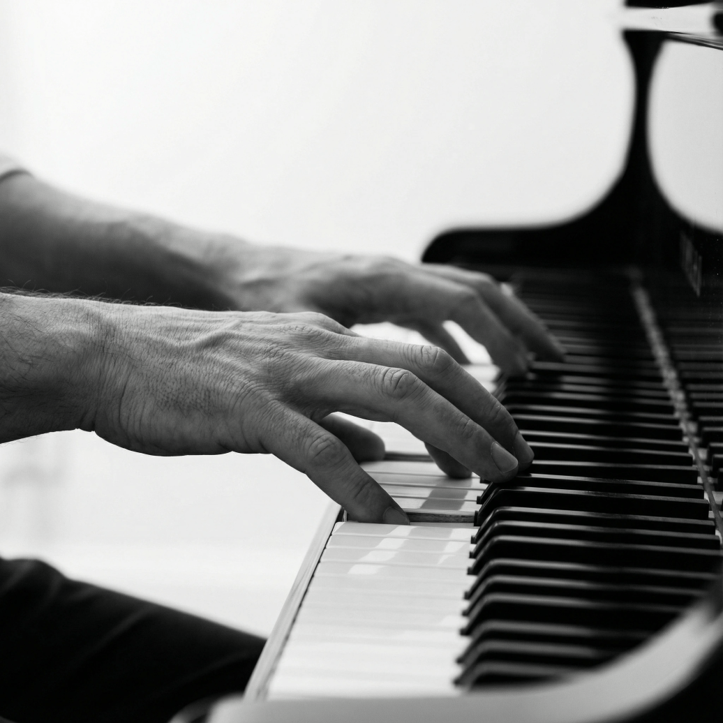 Pianist's hands gracefully performing on grand piano keys